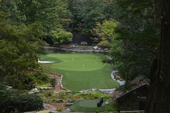Augusta Synthetic Putting Green amidst trees