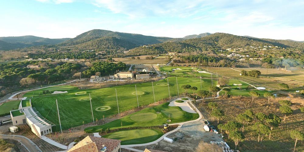 Augusta Aerial view of a synthetic grass golf course surrounded by hills